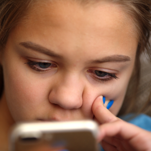Close-up shot of young woman looking at her phone
